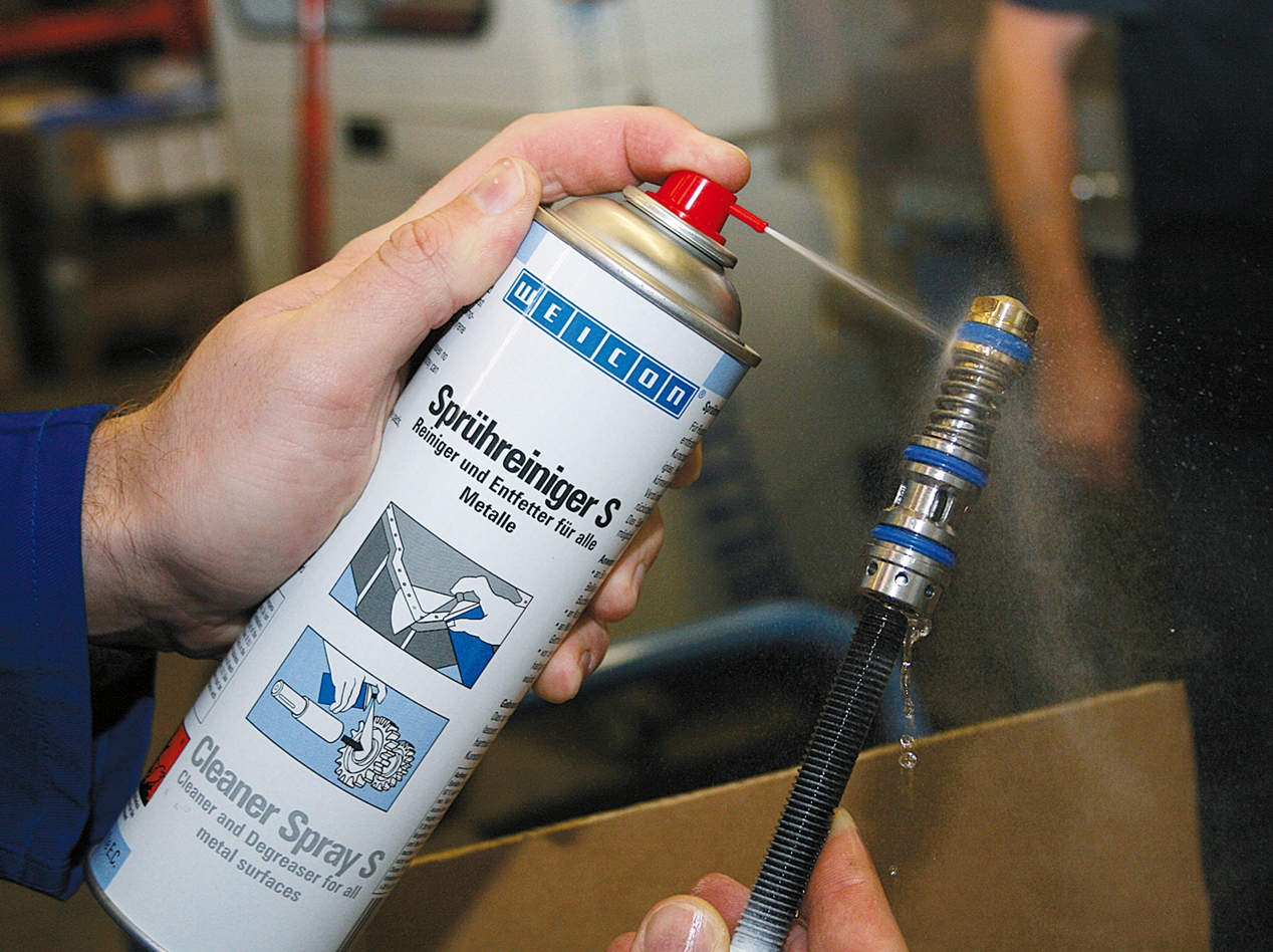Cleaner Spray S being used to clean a hose plug before it is connected